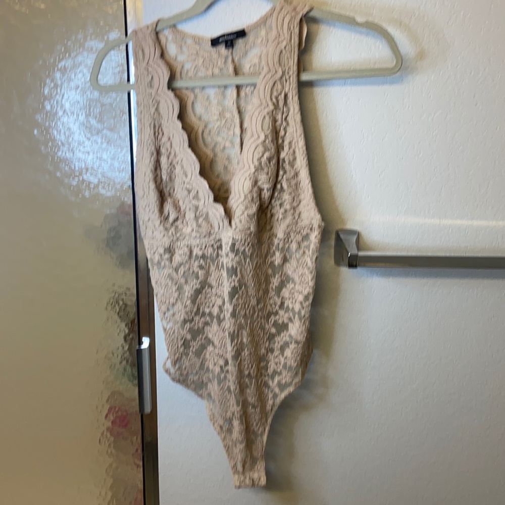 Lace tan bodysuit , kinda low cut
